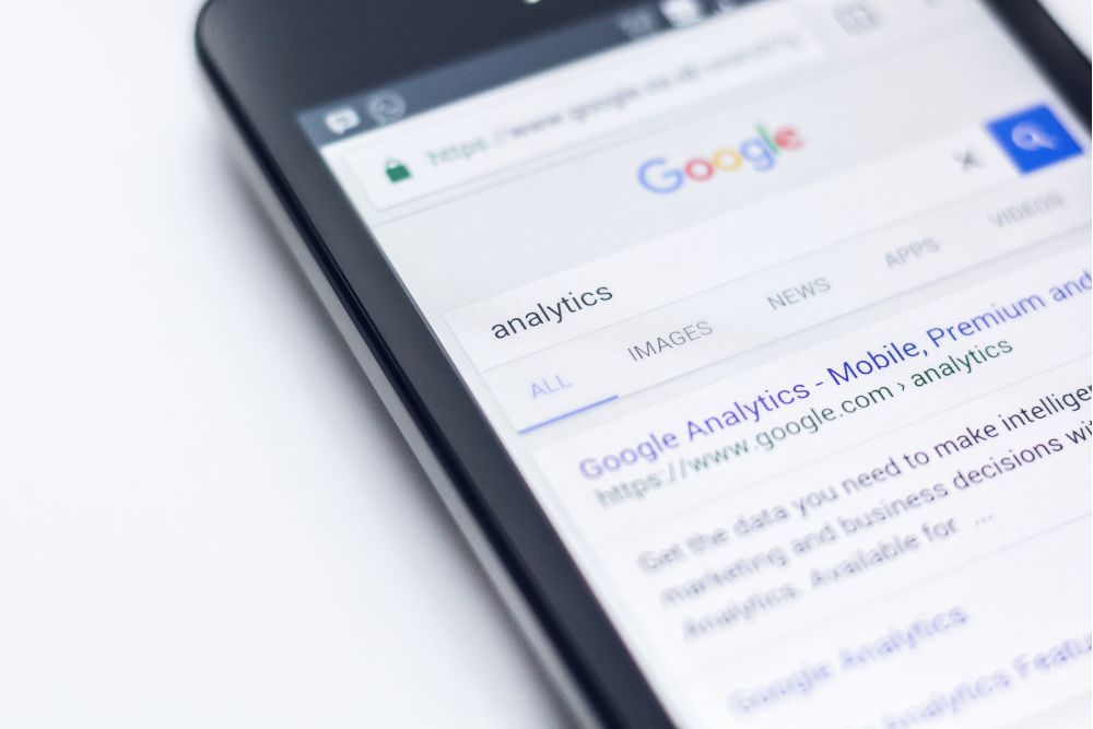 Mobile phone showing Shopify store ranking on page 1 of Google